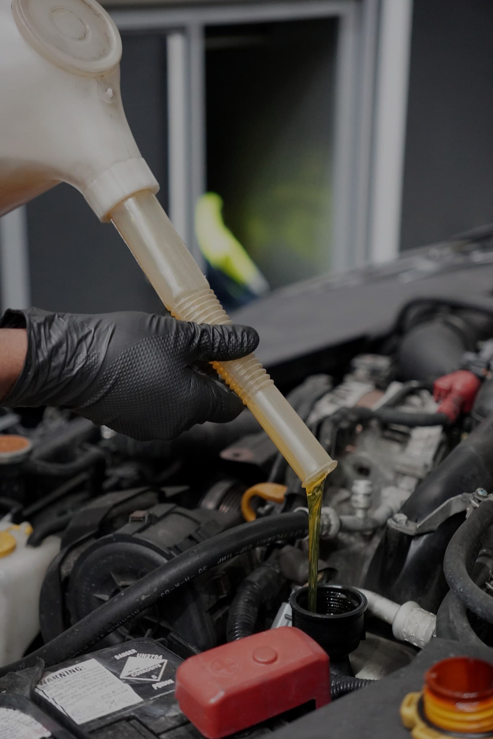 Fresh oil being poured during a logbook service at ASR